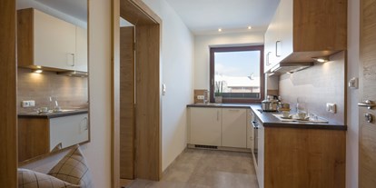 Pensionen - Terrasse - Walchsee - voll ausgestattete Küche - Appartements Ticklhof am See