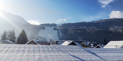 Pensionen - Skilift - Kärnten - Haus Scheiblauer Nassfeld Tröpolach skiing apartment 16 view to the slope - Haus Scheiblauer
