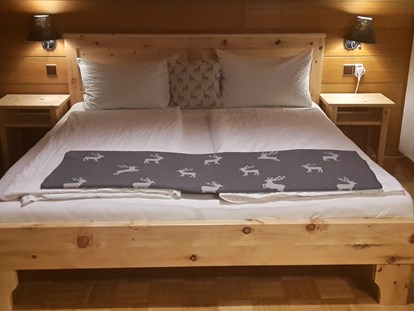 Pensionen - Restaurant - Murnau am Staffelsee - unsere neuen Zirben Betten laden Sie zum Wohlfühlen in den Zimmern ein - Villa Claudia